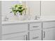 Double vanity bathroom with white cabinets and quartz countertops at 62 Clementine Street St # 182, Angier, NC 27501