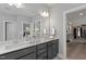 Double vanity bathroom with walk-in closet access at 72 Macy Circle, Wendell, NC 27591