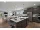 Modern kitchen with island, stainless steel appliances, and open floor plan at 72 Macy Circle, Wendell, NC 27591