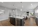 Open concept kitchen with island and stainless steel appliances at 72 Macy Circle, Wendell, NC 27591
