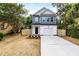 Charming two-story home with a fenced yard and driveway at 807 E Harnett St, Dunn, NC 28334