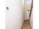 Hallway with wood-look flooring, white walls, and staircase at 807 E Harnett St, Dunn, NC 28334