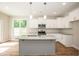 Kitchen featuring white shaker cabinets, granite counters, and stainless steel appliances at 807 E Harnett St, Dunn, NC 28334
