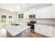 Spacious kitchen with white shaker cabinets, granite countertops and stainless steel appliances at 807 E Harnett St, Dunn, NC 28334