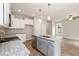 Kitchen with white cabinets, granite countertops, stainless steel appliances, and an island at 807 E Harnett St, Dunn, NC 28334