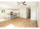 Open concept kitchen and living area with wood-look flooring at 807 E Harnett St, Dunn, NC 28334