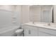 Clean bathroom with double vanity, large mirror, and a shower/tub combo at 900 Canis Minor Rd, Wendell, NC 27591