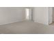 Spacious bedroom with carpet flooring and access to hallway at 900 Canis Minor Rd, Wendell, NC 27591