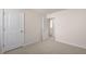 Bright bedroom with neutral walls and carpet, including access to another room at 900 Canis Minor Rd, Wendell, NC 27591