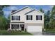 Two-story house with white siding, black shutters, and a two-car garage at 900 Canis Minor Rd, Wendell, NC 27591