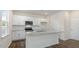 Kitchen with white cabinets, granite countertops and island at 900 Canis Minor Rd, Wendell, NC 27591
