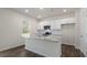 Kitchen with white cabinets, granite counters, and stainless steel appliances at 900 Canis Minor Rd, Wendell, NC 27591
