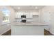 Kitchen with white cabinets, granite countertops and island at 900 Canis Minor Rd, Wendell, NC 27591
