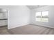 Bright bedroom with large window and wall-to-wall carpet at 11300 International Dr, Middlesex, NC 27557