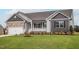Two-car garage and nicely landscaped lawn at 11300 International Dr, Middlesex, NC 27557