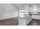 Island kitchen with granite countertops and access to back deck at 11300 International Dr, Middlesex, NC 27557
