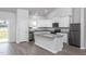 White shaker cabinets, granite countertops, and stainless steel appliances at 11300 International Dr, Middlesex, NC 27557