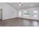 Spacious living room with high ceilings and wood-look flooring at 11300 International Dr, Middlesex, NC 27557