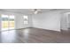 Spacious living room with vinyl plank flooring and lots of natural light at 11800 International Dr, Middlesex, NC 27557
