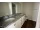 Double vanity bathroom with granite countertops at 130 Tulipfield Way, Benson, NC 27504