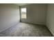 Cozy carpeted bedroom with a large window at 130 Tulipfield Way, Benson, NC 27504