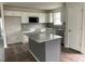 Modern kitchen with granite countertops and an island at 130 Tulipfield Way, Benson, NC 27504