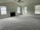 Spacious living room featuring a fireplace and large windows at 130 Tulipfield Way, Benson, NC 27504