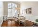 Formal dining room with hardwood floors and large windows at 2 Hunters Green Ct, Durham, NC 27712