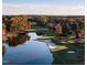 Aerial view of golf course and lake in autumn at 32520 Archdale Dr, Chapel Hill, NC 27517