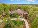 Brick home on wooded lot with large circular driveway at 32520 Archdale Dr, Chapel Hill, NC 27517