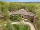 Luxury home nestled in wooded lot with circular driveway at 32520 Archdale Dr, Chapel Hill, NC 27517