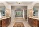 Luxurious bathroom with and vanities and a large soaking tub at 32520 Archdale Dr, Chapel Hill, NC 27517