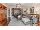 Cozy Gathering room featuring comfortable seating and a large window at 32520 Archdale Dr, Chapel Hill, NC 27517