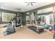 Home gym featuring a treadmill, stationary bike, and weights at 32520 Archdale Dr, Chapel Hill, NC 27517
