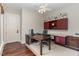 Home office features built-in cabinetry, hardwood floors, and ample workspace at 32520 Archdale Dr, Chapel Hill, NC 27517