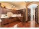 Kitchen with copper sink and dark wood cabinets at 32520 Archdale Dr, Chapel Hill, NC 27517