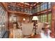 Spacious library with wood paneling, built-in bookshelves, and fireplace at 32520 Archdale Dr, Chapel Hill, NC 27517