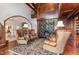 Two story library with comfortable seating and fireplace at 32520 Archdale Dr, Chapel Hill, NC 27517
