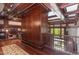 Elegant library with built-in bookshelves and hardwood floors at 32520 Archdale Dr, Chapel Hill, NC 27517