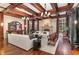 Spacious living room with hardwood floors, fireplace, and built-in bar at 32520 Archdale Dr, Chapel Hill, NC 27517