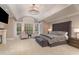Grand main bedroom with a high ceiling, plush carpet, and large windows at 32520 Archdale Dr, Chapel Hill, NC 27517