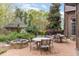 Brick patio with seating area and fire pit at 32520 Archdale Dr, Chapel Hill, NC 27517