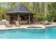 Resort-style pool with hot tub and outdoor bar at 32520 Archdale Dr, Chapel Hill, NC 27517