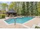 Stunning pool and spa with brick patio at 32520 Archdale Dr, Chapel Hill, NC 27517