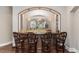 Basement wet bar with custom cabinetry and seating at 32520 Archdale Dr, Chapel Hill, NC 27517
