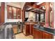 Modern wet bar with granite countertops and wine cooler at 32520 Archdale Dr, Chapel Hill, NC 27517