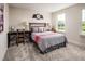 Cozy bedroom featuring a bed, desk, chair, and window views at 604 Mohinda Way, Willow Springs, NC 27592