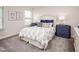 Bright bedroom with carpeted floor, full bed, and two nightstands at 604 Mohinda Way, Willow Springs, NC 27592