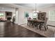 Bright dining room with hardwood floors and a charming chandelier at 604 Mohinda Way, Willow Springs, NC 27592