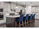 Modern kitchen with stainless steel appliances and a large island at 604 Mohinda Way, Willow Springs, NC 27592